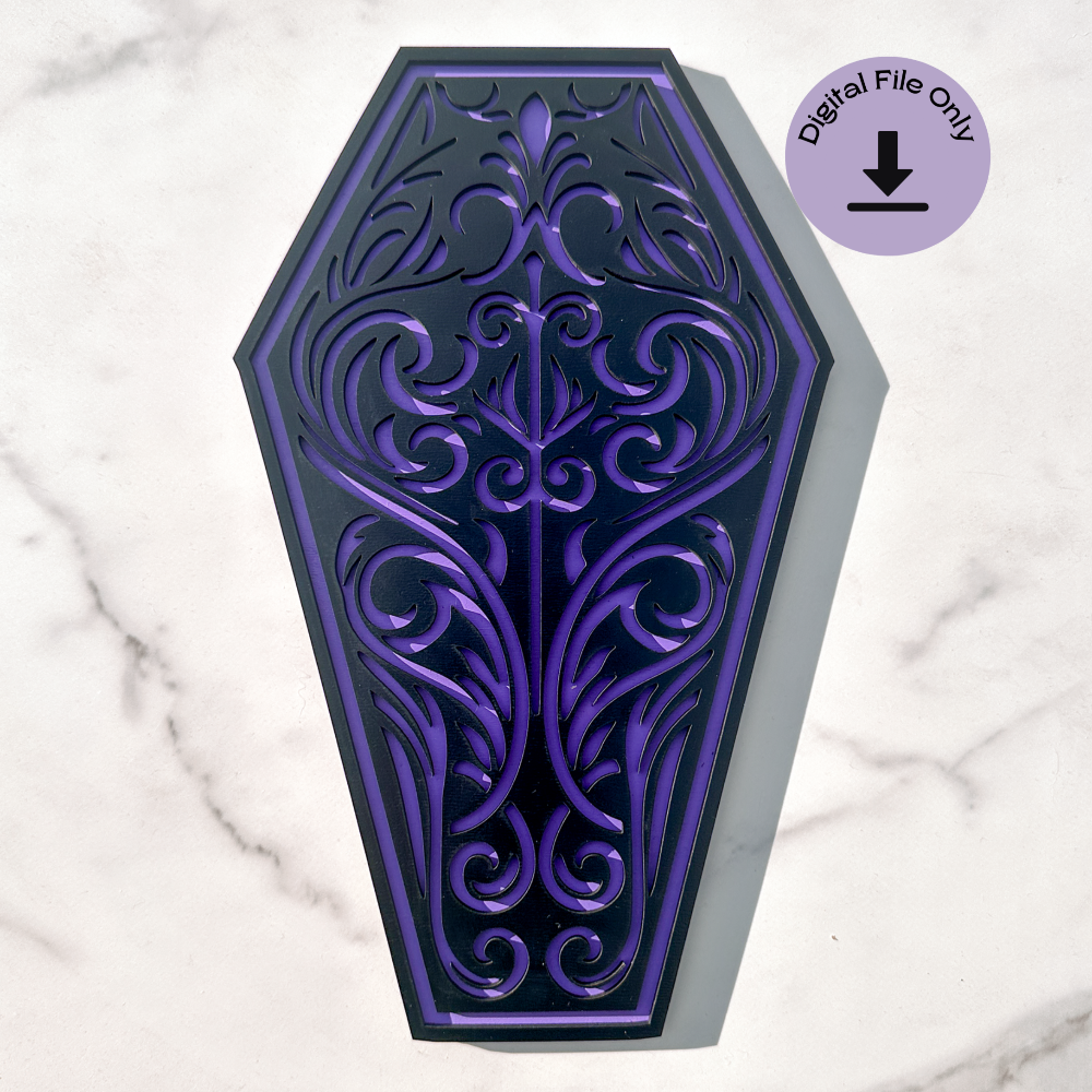 An intricate gothic coffin laser cut design displayed on a light wood background. The coffin shape features an ornate filigree pattern, optimized for laser cutting in wood, acrylic, and MDF. Includes SVG, DXF, and AI file formats for CNC and laser engraving projects. Digital file only—no physical item.