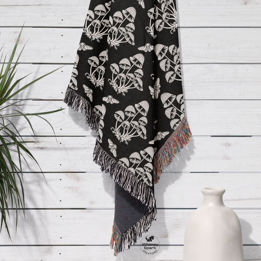 Mushroom pattern blanket in black and white hanging up