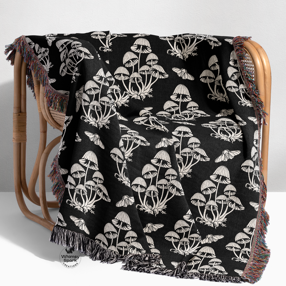 Blank and white mushroom woven blanket with moths on a chair