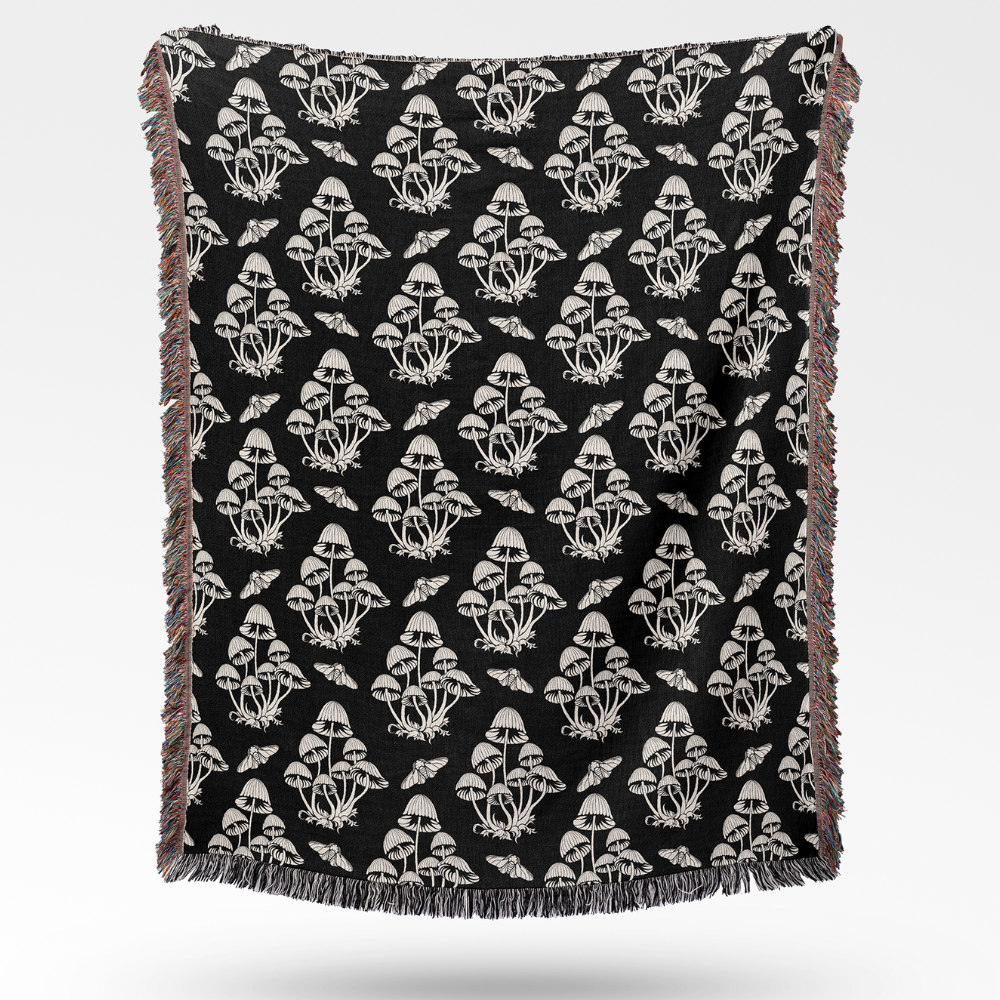 Black and white mushrooms and moths woven tapestry blanket with fringe 